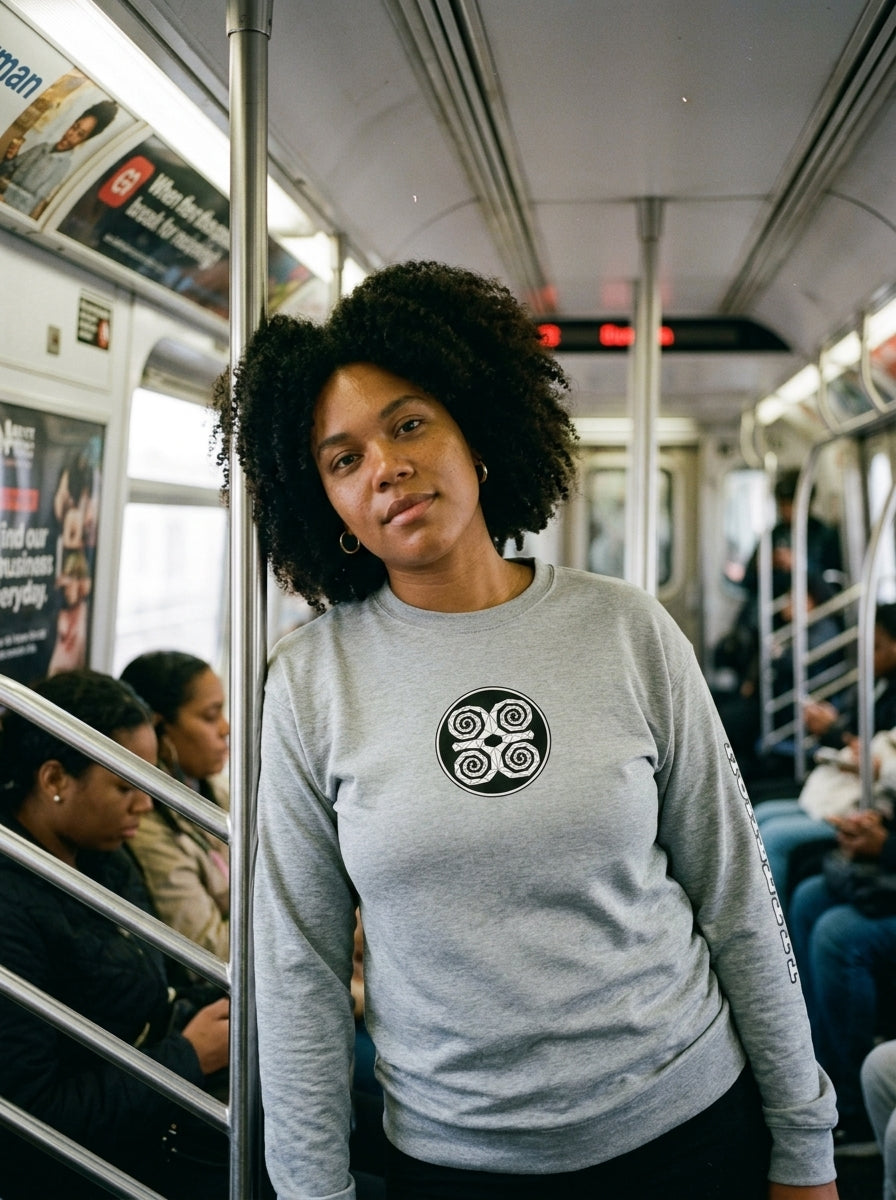 SunBorn Adinkra // Humility Sweatshirt in Ntụ Gray, styled in a real-world lifestyle setting