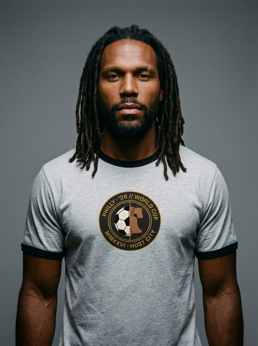 Liberty Protocol // Philly '26 Tee — front hero studio shot, heather grey ringer tee with circular Liberty Bell + soccer ball federation crest, Philadelphia World Cup 2026 Host City Series | SunBorn