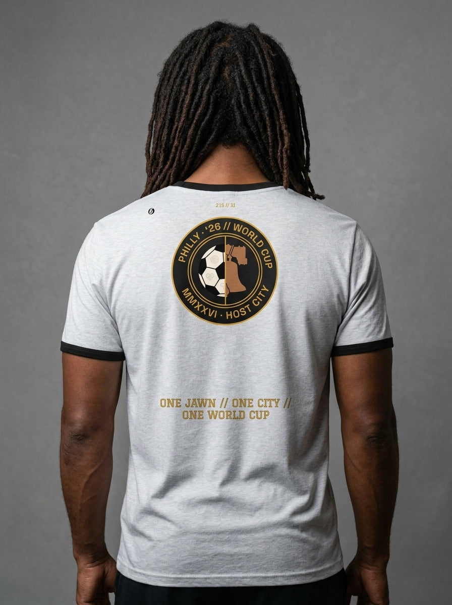 Liberty Protocol // Philly '26 Tee — back studio view, heather grey body with black ringer trim, One Jawn // One City // One World Cup hem stamp | SunBorn