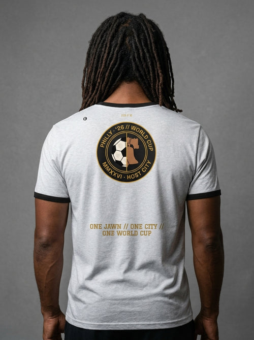 Liberty Protocol // Philly '26 Tee — back studio view, heather grey body with black ringer trim, One Jawn // One City // One World Cup hem stamp | SunBorn
