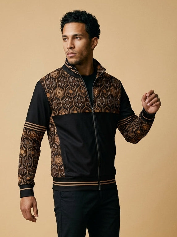 AnanseNova™ Statement Track Jacket in Oji Black — three-quarter left view on model, full-zip track jacket with hexagon yoke and forearm panels