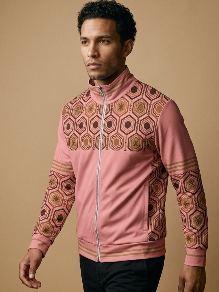 AnanseNova™ Statement Track Jacket in Eze Pink — front view on model, hexagon web-cell yoke, stand collar and triple-stripe trim on a full-zip track jacket