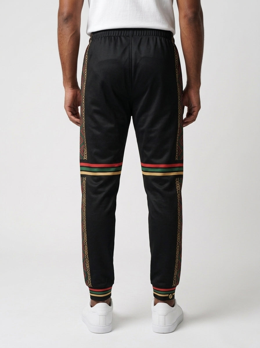 N'Donso™ Men's Joggers in Uhie Red, back view — Hunter's Road print down the outer side of each leg with three-stripe bands at the knee and cuff.