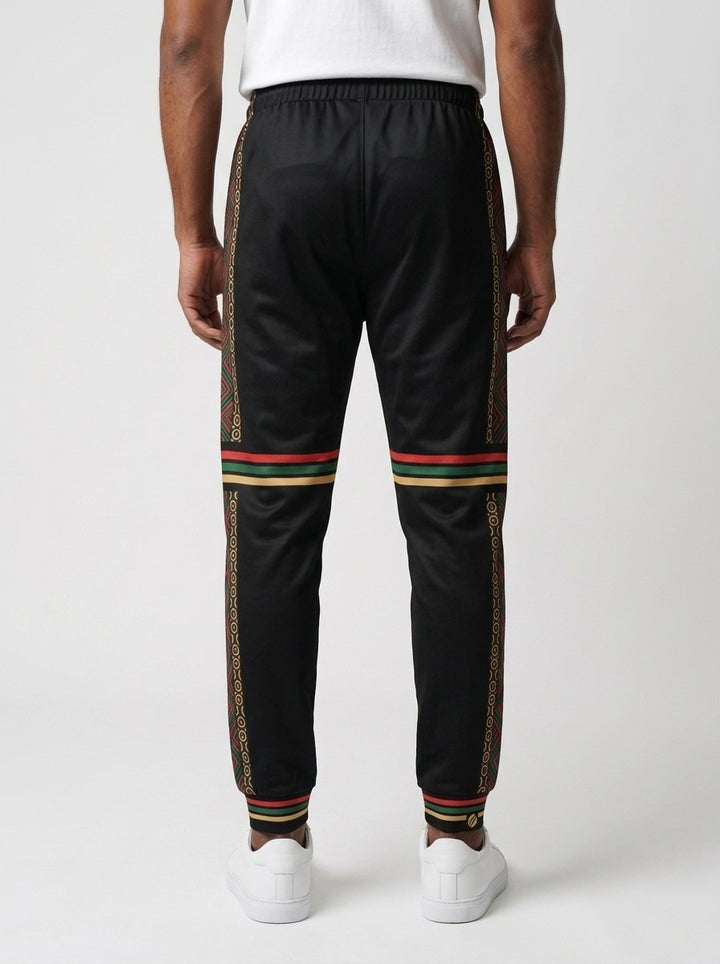N'Donso™ Men's Joggers in Uhie Red, back view — Hunter's Road print down the outer side of each leg with three-stripe bands at the knee and cuff.