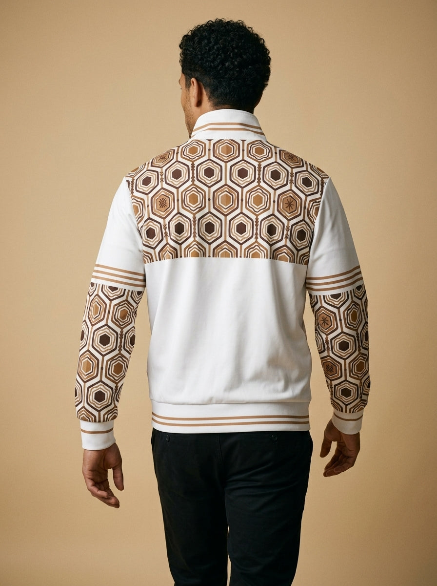 AnanseNova™ Statement Track Jacket in Ocha White — back view on model, hexagon print across the upper back and shoulders with striped cuffs and hem