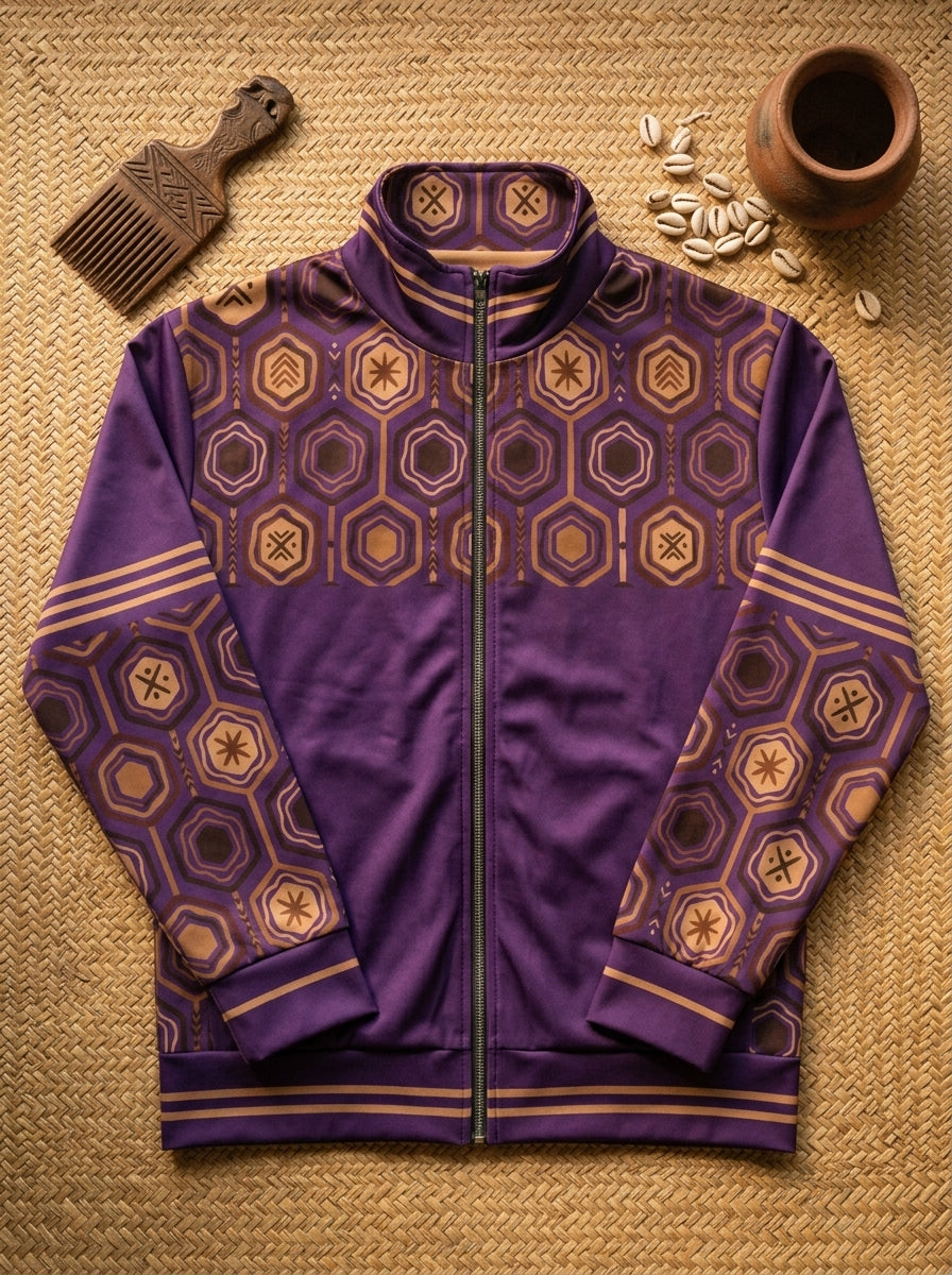 AnanseNova™ Statement Track Jacket in Ugo Purple — styled flat lay of the full-zip track jacket with hexagon print, laid on woven textiles