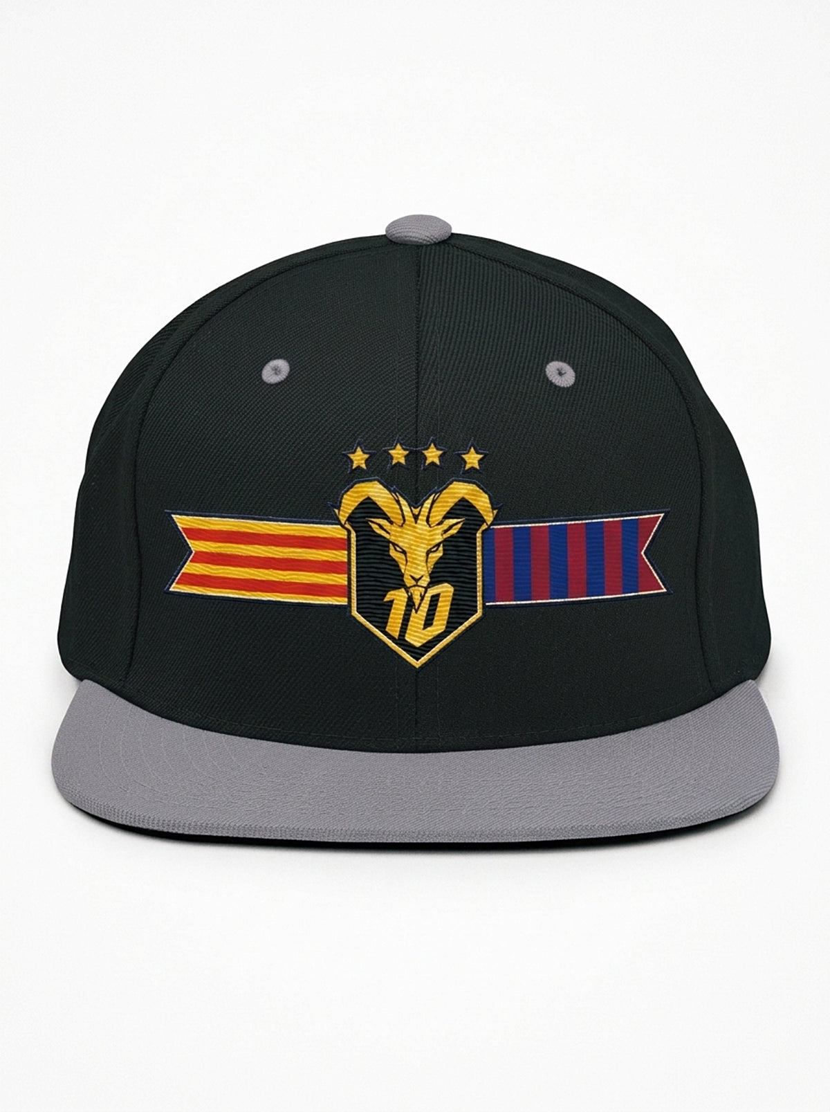GOAT Catalan two-tone snapback in Oji Black / Ọnwa Silver, front view — the full-colour Catalan crest on the crown: gold goat, No. 10, four stars, split Senyera and blaugrana banner.