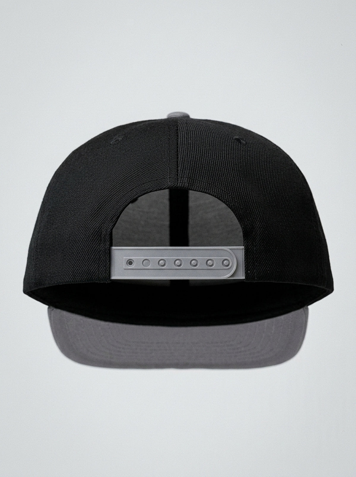 GOAT Catalan two-tone snapback in Oji Black / Ọnwa Silver, back view — snapback closure.