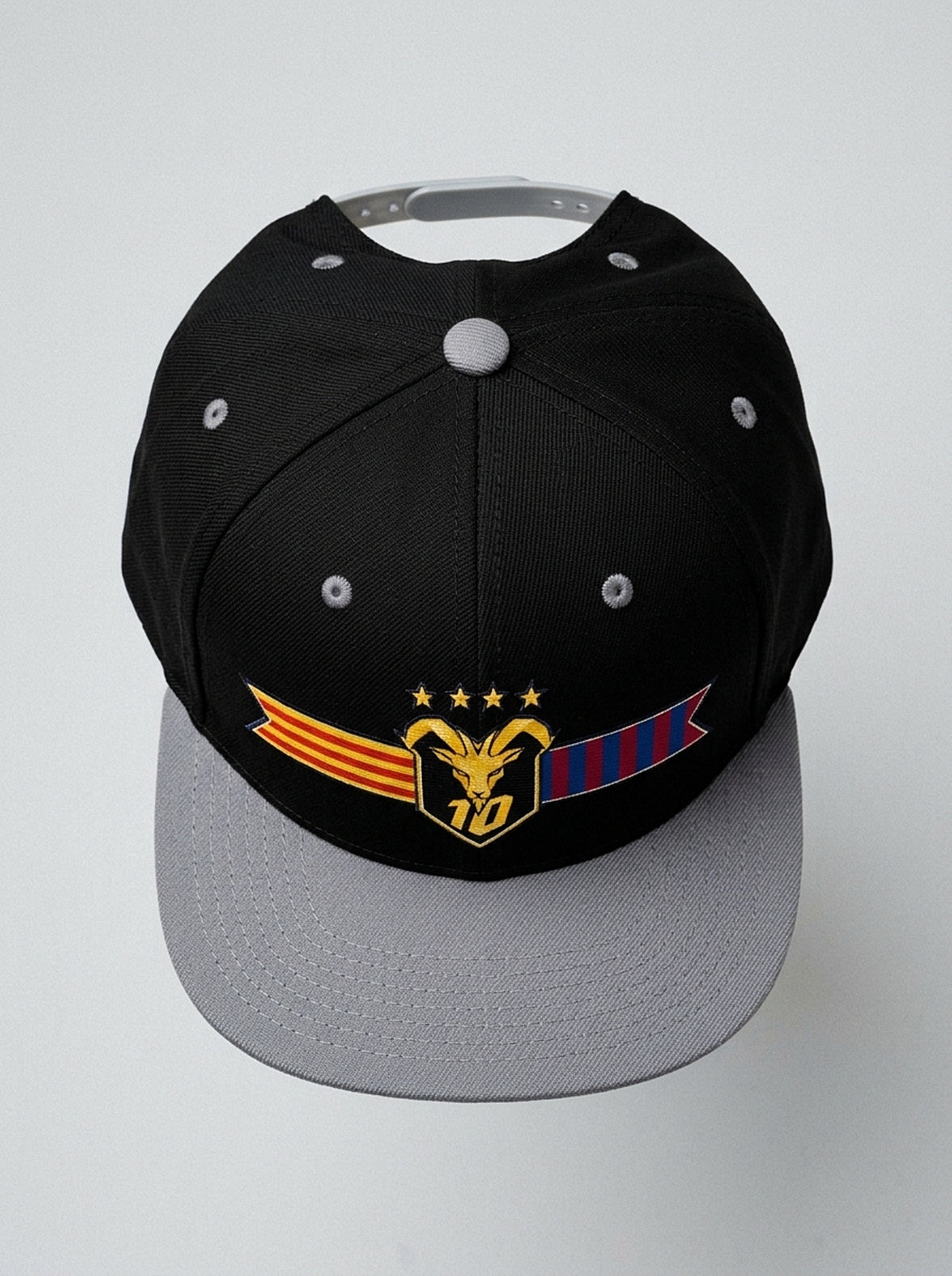GOAT Catalan two-tone snapback in Oji Black / Ọnwa Silver, top-down view of the structured crown.