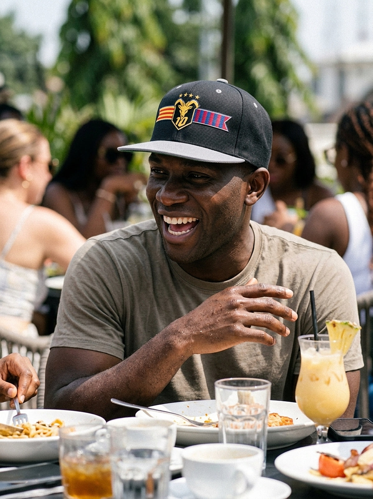 Lifestyle action shot of the GOAT Catalan two-tone snapback in Oji Black / Ọnwa Silver.