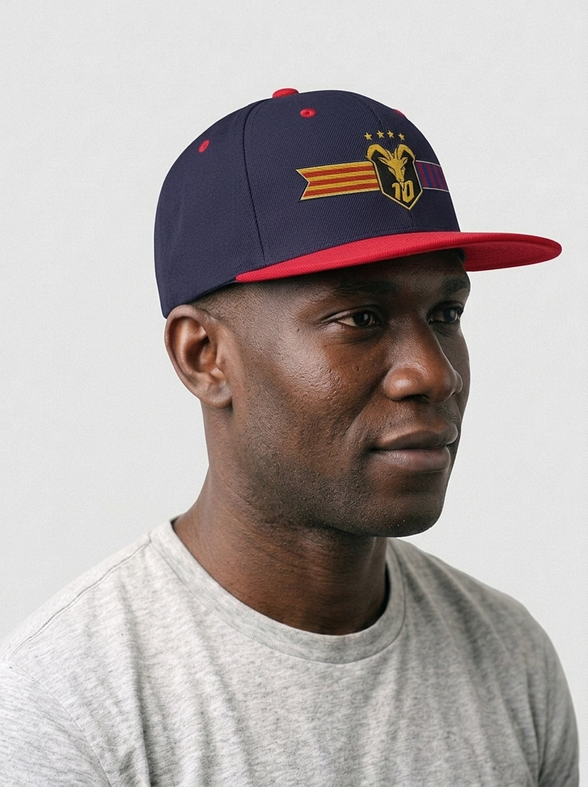 GOAT Catalan two-tone snapback in Anụnụ Blue / Uhie Red, three-quarter right view.