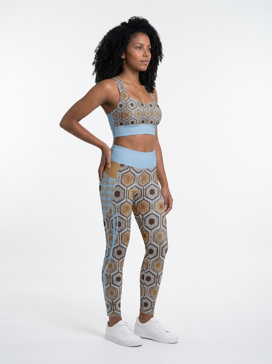 AnanseNova™ Set // Bra + Pocket Leggings in Igwe Blue — three-quarter right view on model, matching longline bra and pocket leggings