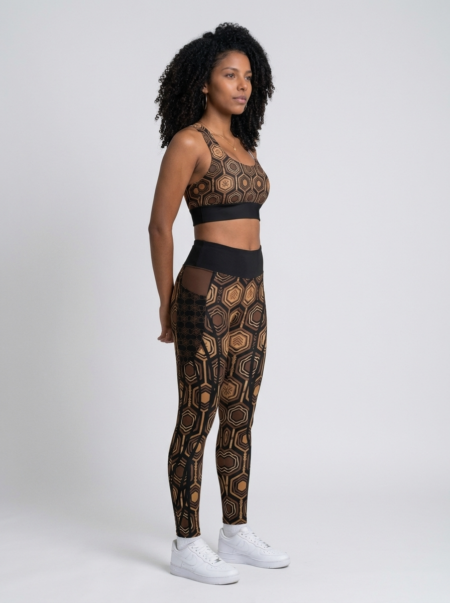 AnanseNova™ Set // Bra + Pocket Leggings in Oji Black — three-quarter right view on model, matching longline bra and pocket leggings