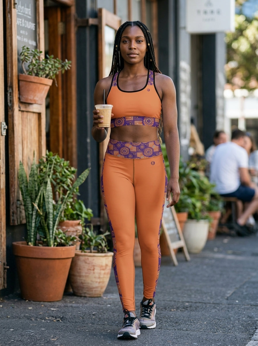 Sankofa Set // Bra + Leggings — Sango Orange colorway — outdoor candid shot — SunBorn