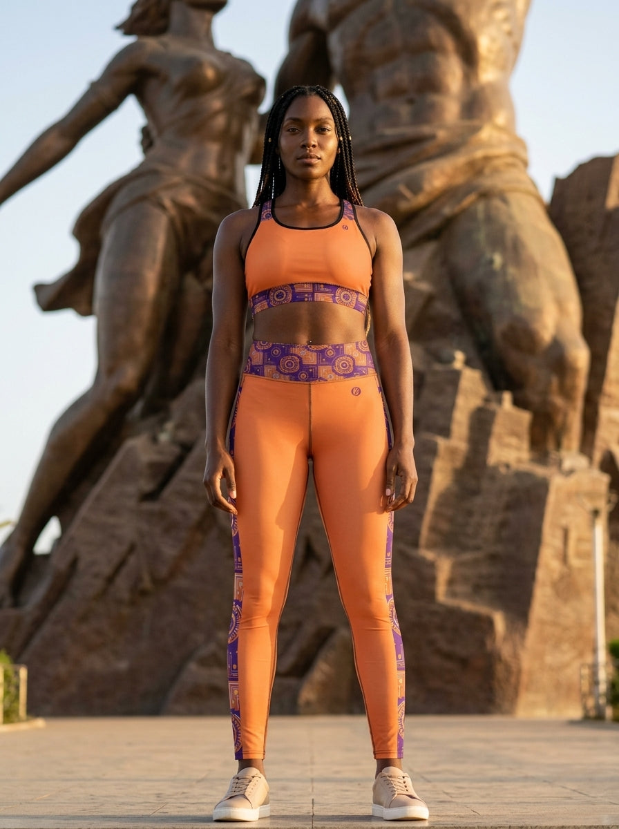 Sankofa Set // Bra + Leggings — Sango Orange colorway — editorial golden hour portrait — SunBorn