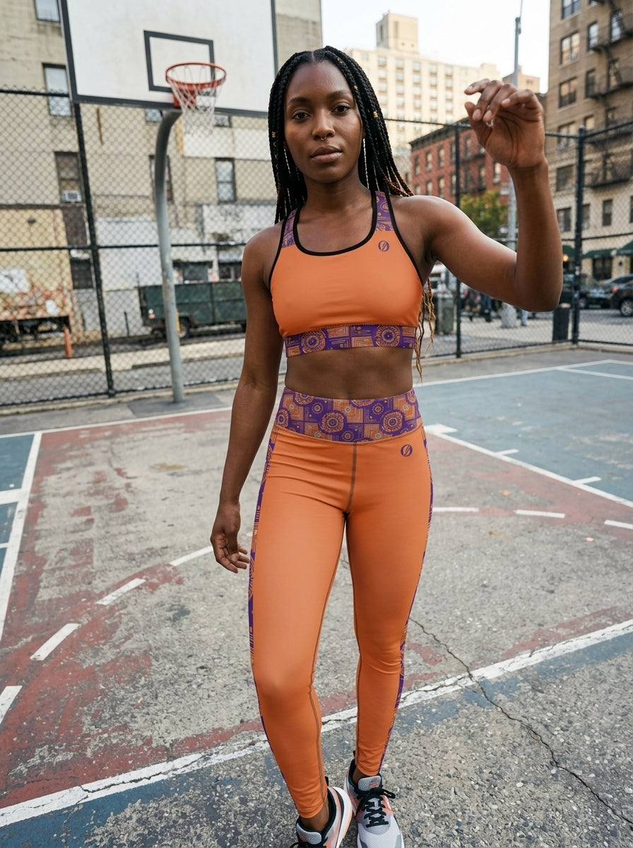 Sankofa Set // Bra + Leggings — Sango Orange colorway — studio front view, wide framing — SunBorn