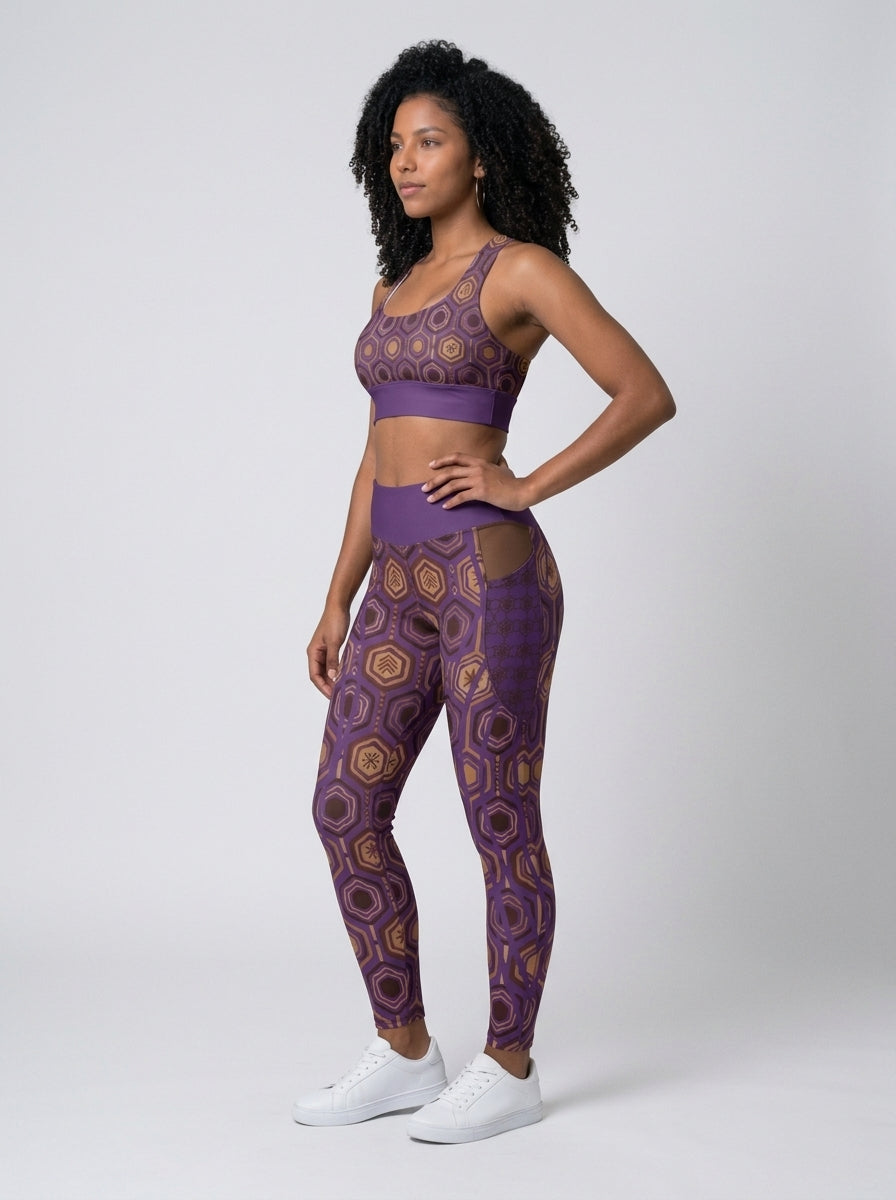 AnanseNova™ Set // Bra + Pocket Leggings in Ugo Purple — three-quarter left view on model, matching longline bra and pocket leggings