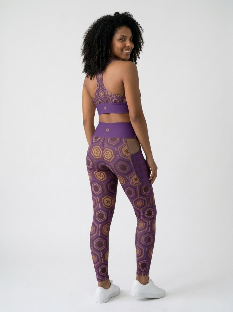 AnanseNova™ Set // Bra + Pocket Leggings in Ugo Purple — back view on model, racerback bra and leggings back waistband with SunBorn crest