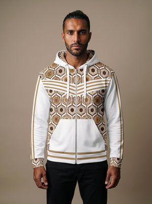 AnanseNova™ Zip Hoodie in Ocha White, front view on model — hexagon all-over print, bronze chevron stripes, full zip