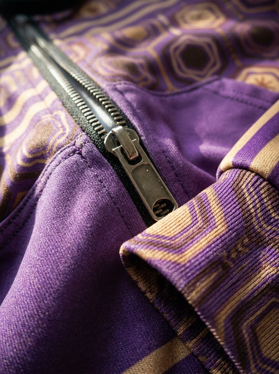 AnanseNova™ Zip Hoodie in Ugo Purple, close-up of metal zipper, ribbed hexagon cuff and print detail
