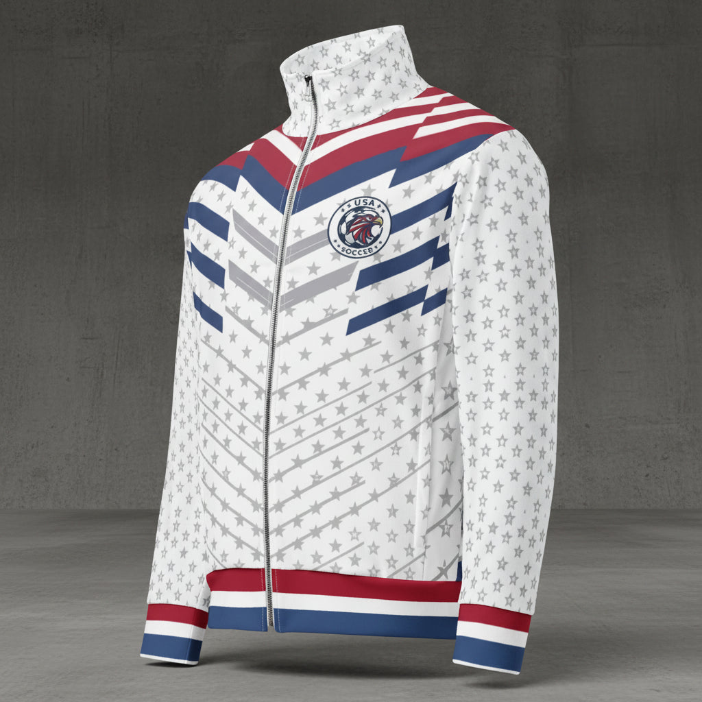 USA '26 Track Jacket — three-quarter front-left view showing the kinetic chevron pattern, full-zip closure with silver hardware, side-seam hand pockets