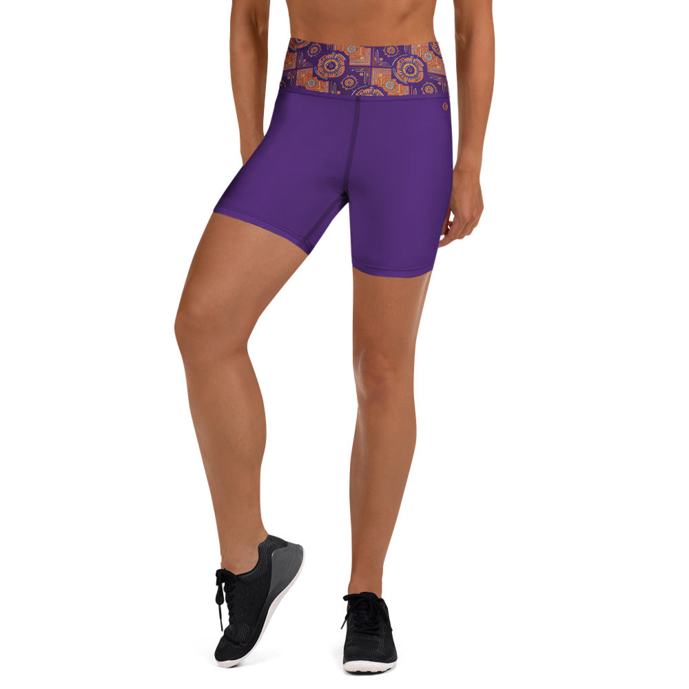 Sankofa Yoga Shorts in the purple, burnt orange and cyan Kinetic Engine print, front view.