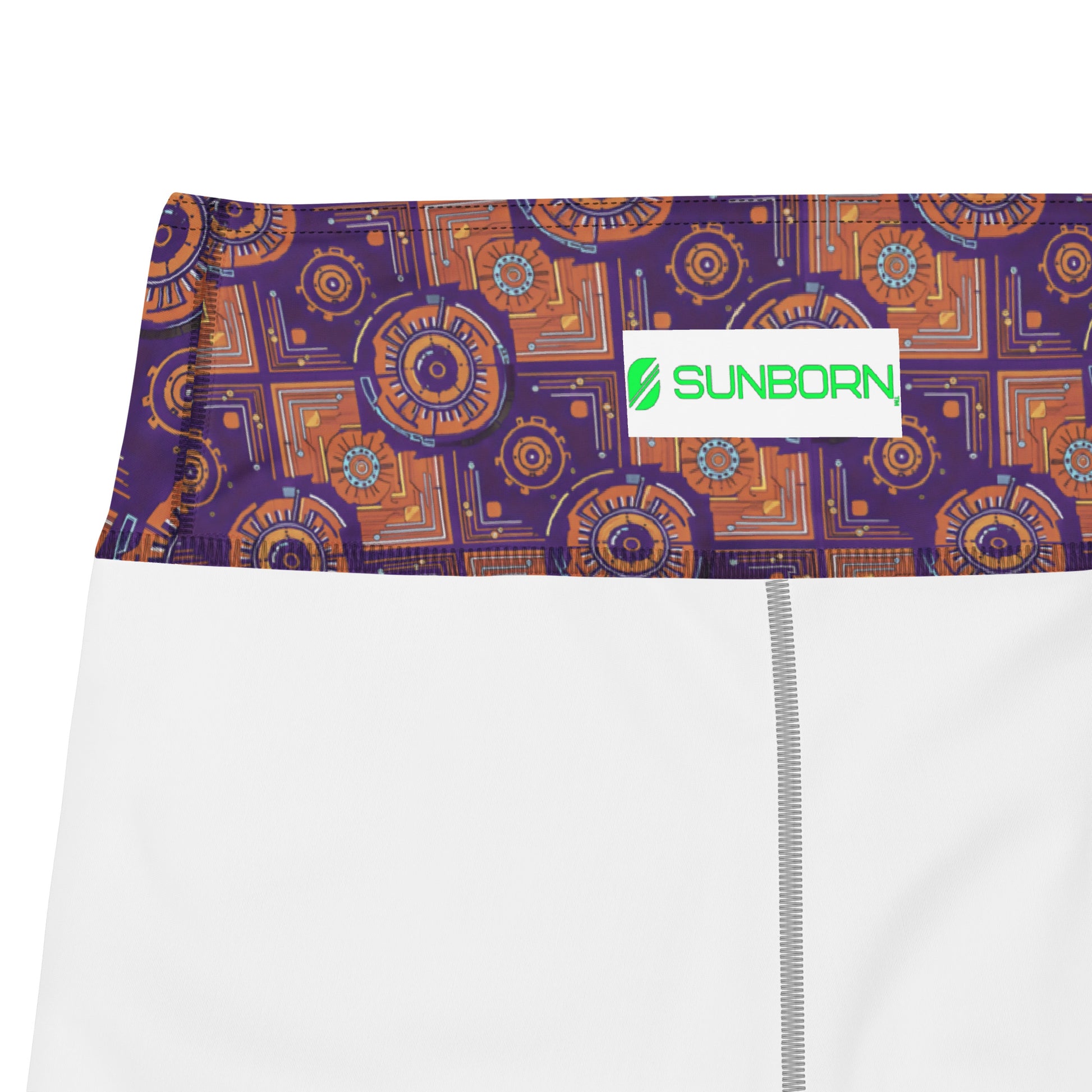 Close-up of the purple, burnt orange and cyan Kinetic Engine print and stitching on the Sankofa Yoga Shorts.