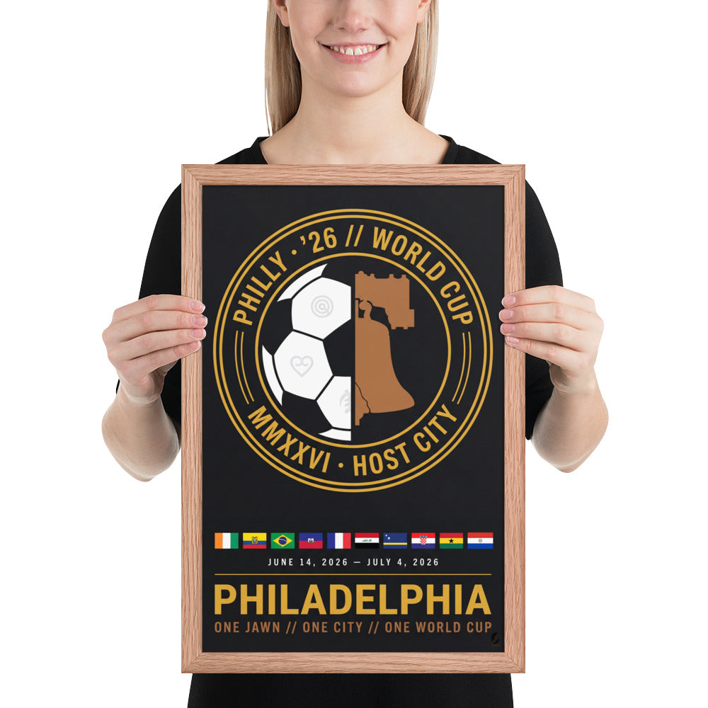 A person holds the 12x18 Philadelphia '26 Host City Crest Poster in a red oak frame, showing its scale.
