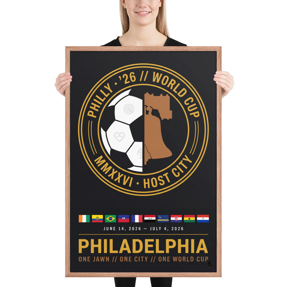 A person holds the 24x36 Philadelphia '26 Host City Crest Poster in a red oak frame, showing its scale.